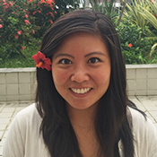 Headshot of Dr. Courtney Choy smiling with a flower in her hair