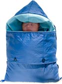 Sleeping infant swaddled in thick blue sleeping bag-like infant warmer