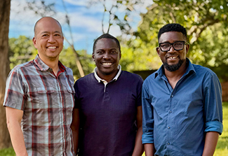 Benjamin Chi, Lameck Chinula, and Friday Saidi, smiling