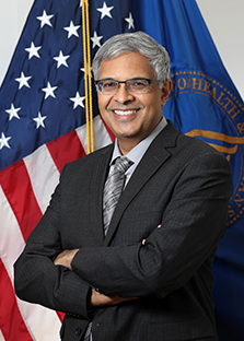 Photo of NIH Director Jay Bhattacharya, smiling