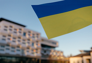A Ukranian flag flies in front of a building at the Ukrainian Catholic University in Lviv, Ukraine.