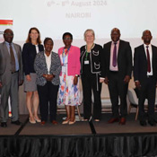 In this photo, Fogarty Director Dr. Kathy Neuzil (second from left) poses with other presenters at at AFREhealth’s Seventh Annual Symposium.