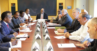 African delegation and NIH leadership seated around a large conference table