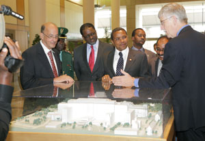 Dr Glass, Dr Gibbons, Tanzania President Jakaya Kikwete, Dr Collins and others view NIH model in clinical center lobby