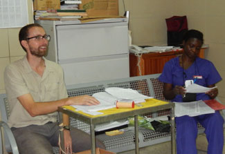 Andrew Gardner and medical worker in the hospital in Ghana
