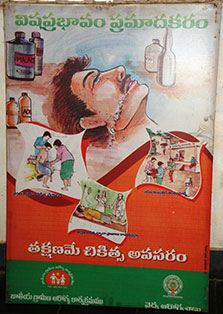 Billboard in India shows illustration of a person who has ingested poison surrounded by illustrations of other dangers of poison