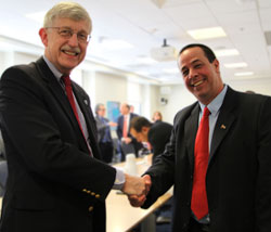 Dr. Francis S. Collins shakes hands with Dr. Jose Angel Portal Miranda on the NIH campus
