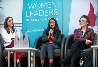 Three women participate in a panel discussion during the 2018 Women Leaders in Global Health conference.