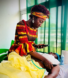 Cameroonian trauma care physician, Dr. Marpha, learning to perform smartphone-based ultrasound on a standardized patient