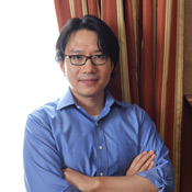 The photo on this page is a of Dr. Kaiyuan Sun, wearing a blue collared shirt and glasses.