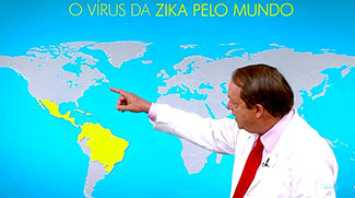 Fabio Mesquita points to section of a world map highlighted yellow (Mexico, Caribbean, north South America) labelled O Virus Da Zika Pelo Mundo