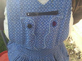Close-up of an apron worn by a study participant with a large pocket to hold a monitoring device.