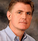 Headshot of Warren Casey