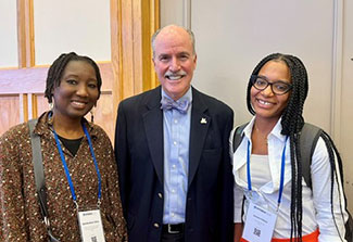 Dr. Peter Kilmarx and two LAUNCH trainees