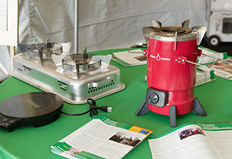 Display table with three examples of clean cookstoves