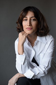 Tamar Kashibadze, a Georgian public health scientist, is photographed wearing a white blouse.