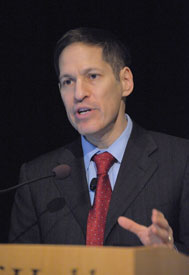 Close-up of CDC Director Dr. Thomas R. Frieden, speaking into a microphone at a podium