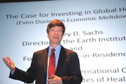 PHOTO: Dr. Jeffrey Sachs speaks in front of a screen showing his slides